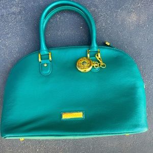 Joy and Iman Turquoise handbag in new condition. Never been used.